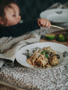 table setting with meatballs and spaghetti and lille boy