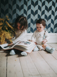 my boys wearing gobabygo socks reading a book